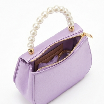 Top-down open view of mini satin bag showing interior lining and capacity