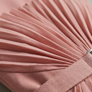 Macro view of delicate sunburst pleated organza and brushed silver utility buckle detail Cascade.